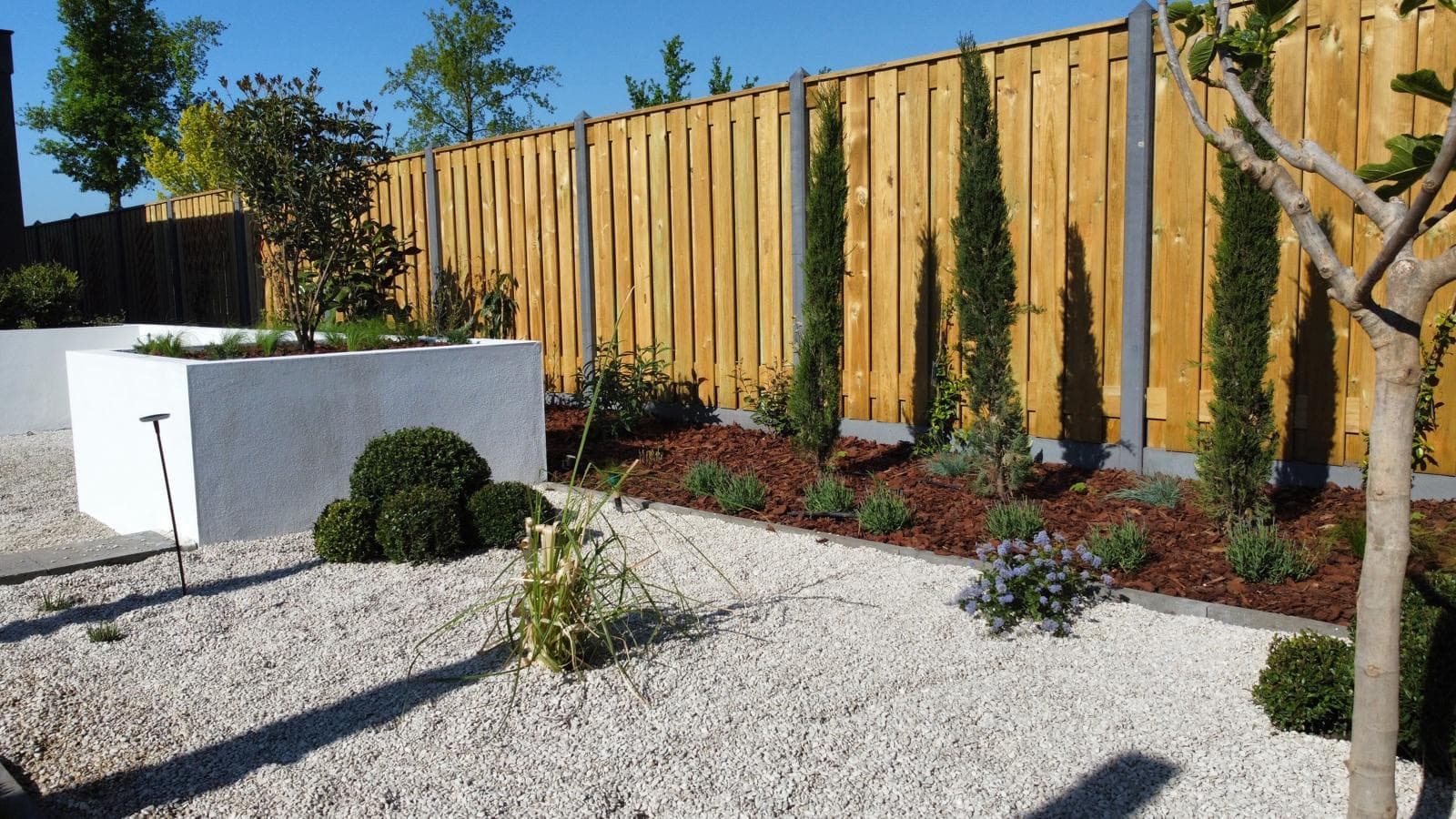 Tuinontwerp met grindtuin en beplanting in regio Breda