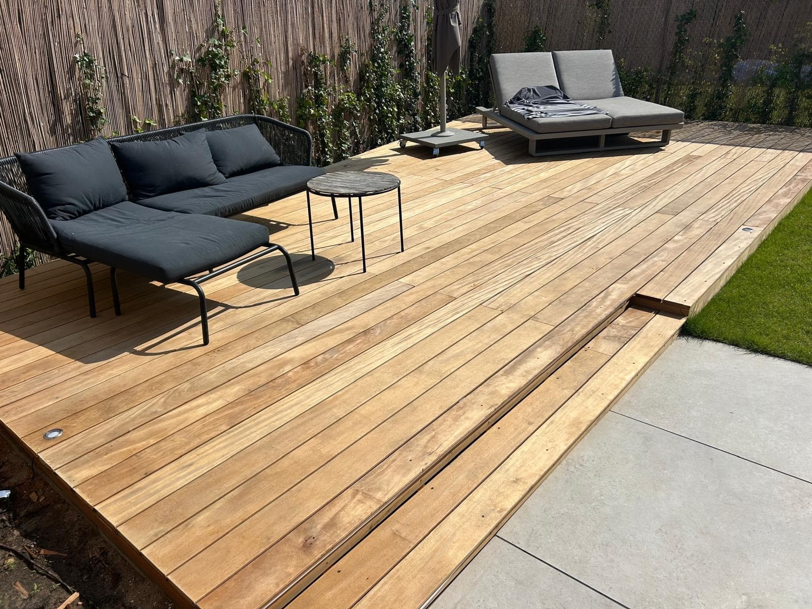 Hardwood decking with lounge set and double sun lounger